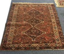 A small Oriental rug. Est. £25 - £35.