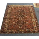 A small Oriental rug. Est. £25 - £35.