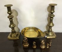 A pair of brass candlesticks, weights etc. Est. £1
