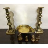 A pair of brass candlesticks, weights etc. Est. £1