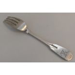 PAUL STORR: A large crested silver table fork. Lon