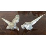 A good pair of cast silver pheasants with textured