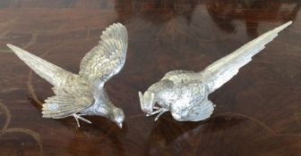 A good pair of cast silver pheasants with textured