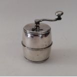 An unusual heavy barrel shaped pepper grinder. Mar