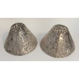 A pair of unusual silver lampshades decorated with