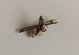 A 15 carat brooch in the form of a bug with outstr