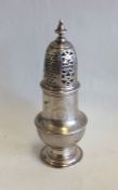 A Georgian silver baluster shaped caster with cres