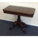 A good quality Victorian rosewood card table on fo