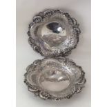 A pair of Edwardian silver large circular dishes w