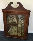 A Georgian mahogany small corner cupboard with str