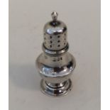 A miniature silver sugar caster of typical form. A