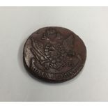 A heavy brass coin dated '1794'. Est. £25 - £35.