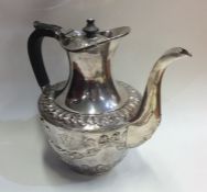 A good quality heavy silver water jug decorated wi
