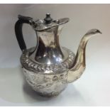 A good quality heavy silver water jug decorated wi