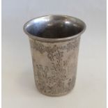 A Continental silver beaker decorated with flowers