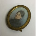 A small oval miniature watercolour of a lady in br