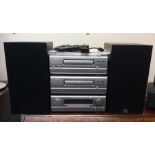 A Denon music system and speakers. Est. £30 - £50.