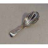 EXETER: A rare silver fluted caddy spoon of fiddle