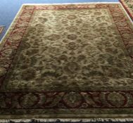 A large Oriental style carpet. Est. £50 - £80.