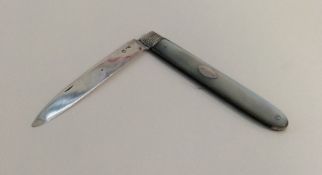 A large silver and MOP fruit knife with reeded dec