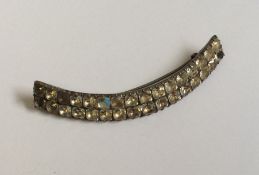 A Georgian crescent shaped brooch. Approx. 9 cms a