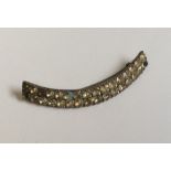 A Georgian crescent shaped brooch. Approx. 9 cms a