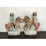A pair of pottery Staffordshire flatback figures;