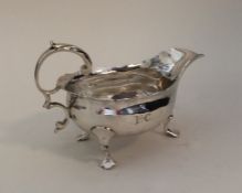 A George III silver sauce boat. London 1764. By GS