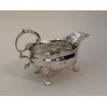 A George III silver sauce boat. London 1764. By GS