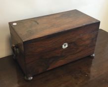 A Georgian rosewood tea caddy with fitted interior