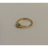 A small gold single stone diamond ring in claw mou
