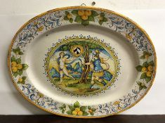A large Continental pottery oval dish mounted with