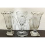 A tapering glass goblet together with two vases. E
