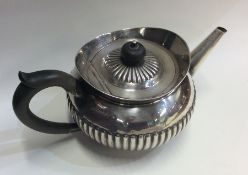 A Victorian silver half fluted bachelor's teapot w