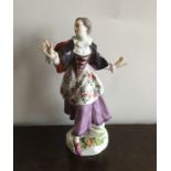 A Meissen figure of a dancing girl on floral base.