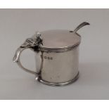 An Edwardian silver drum mustard with hinged top.