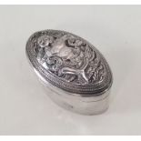 An unusual oval Burmese silver box attractively de