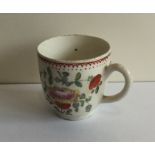 An Antique coffee cup decorated with flowers and l
