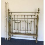 A brass double bed frame with turned tops. Est. £3