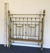 A brass double bed frame with turned tops. Est. £3