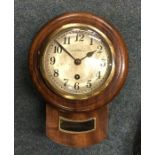 A small mahogany cased wall clock. By Dossor of We