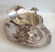 A heavy French silver double sided sauce boat with
