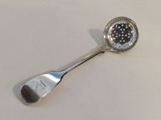 A fiddle pattern silver sifter spoon with crested