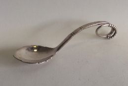 GEORG JENSEN: A stylish silver preserve spoon of t