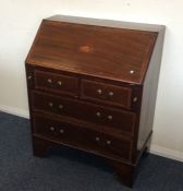 A Victorian bureau with shell decoration. Est. £30