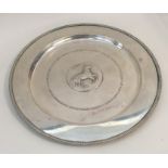 A silver circular presentation salver mounted with