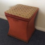 A shaped ottoman with tapestry top. Est. £10 - £20
