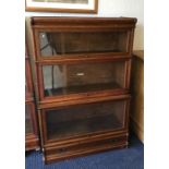 An oak three stack Globe Wernicke bookcase. Est. £