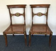 An attractive pair of Regency dining chairs with b