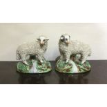 A pair of Staffordshire sheep. Est. £30 - £50.
